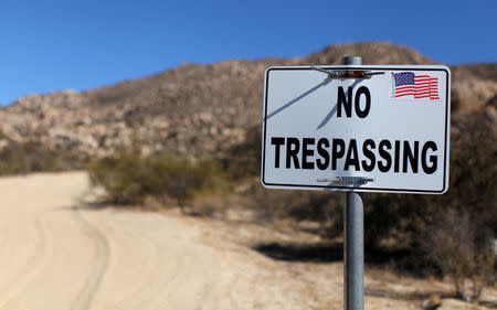 A sign stands on a private property near the U.S.-Mexico border fence near Jacumba, California, U.S., November 14, 2016. REUTERS/Mike Blake