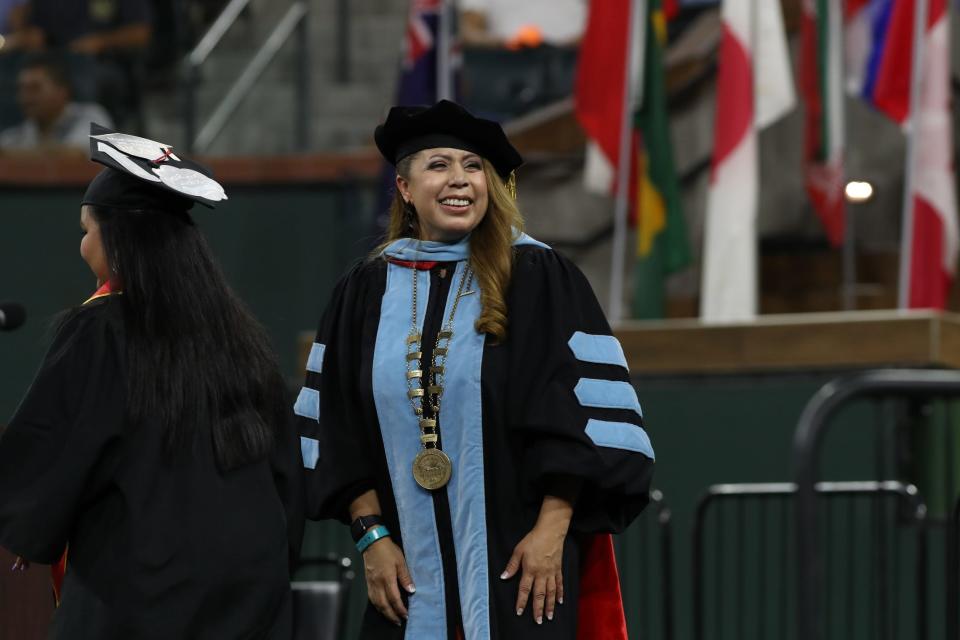 College of the Desert President Martha Garcia, Ed.D. greets graduates as they receive their diplomas during the commencement ceremony at the Indian Wells Tennis Garden in Indian Wells, Calif., on Wednesday, May 25, 2022. 