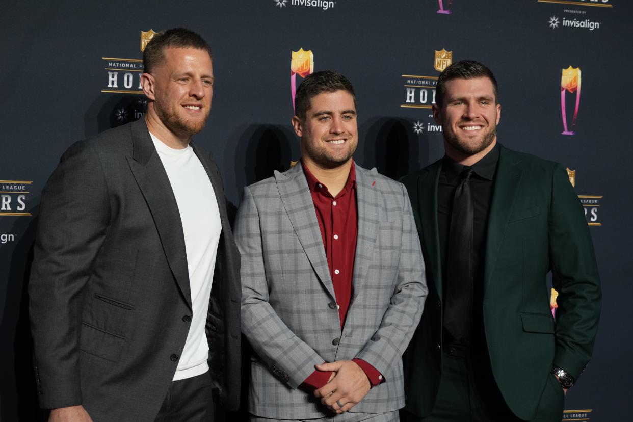 J.J. Watt (left) with his brothers Derek Watt and T.J. Watt (right) appears on the red carpet prior to the NFL Honors awards presentation at YouTube Theater.