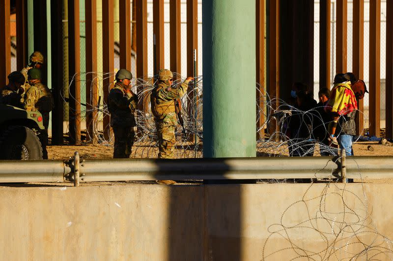 Members of the Texas National Guard stand guard on the banks of the Rio Bravo river with the purpose of reinforcing border security and inhibiting the crossing of migrants to the U.S.