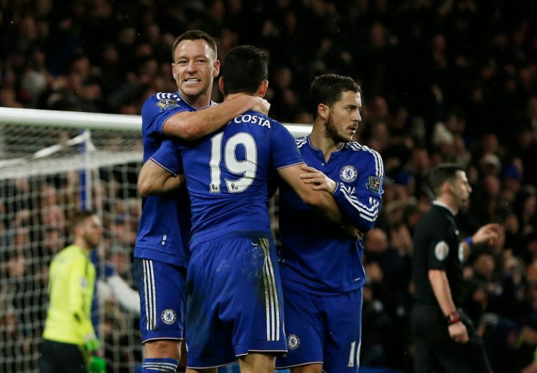 Chelsea's striker Diego Costa (C) celebrates with defender John Terry (L) and midfielder Eden Hazard after scoring during an English Premier League football match against Manchester United at Stamford Bridge in London on February 7, 2016