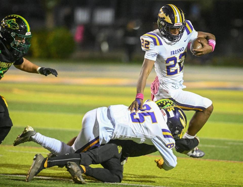 Fresno High’s Damareea Farris gets caught in the backfield for a loss by the Roosevelt defense during the annual Little Big Game against Roosevelt at Sunnyside High School Stadium on Friday, Oct. 27, 2023.