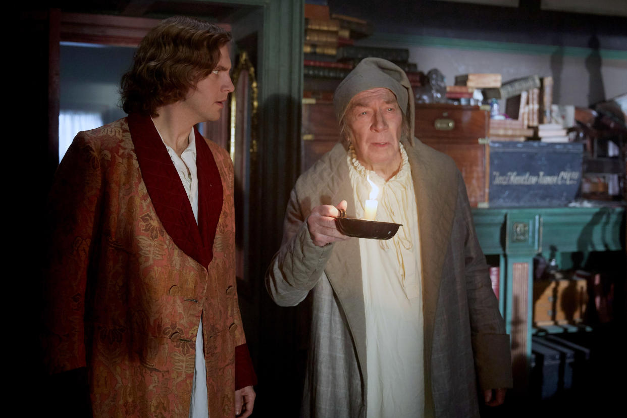 Dan Stevens as Charles Dickens and Christopher Plummer as Scrooge in <em>The Man Who Invented Christmas</em> (Photo: Bleecker Street Media /Courtesy of Everett Collection)