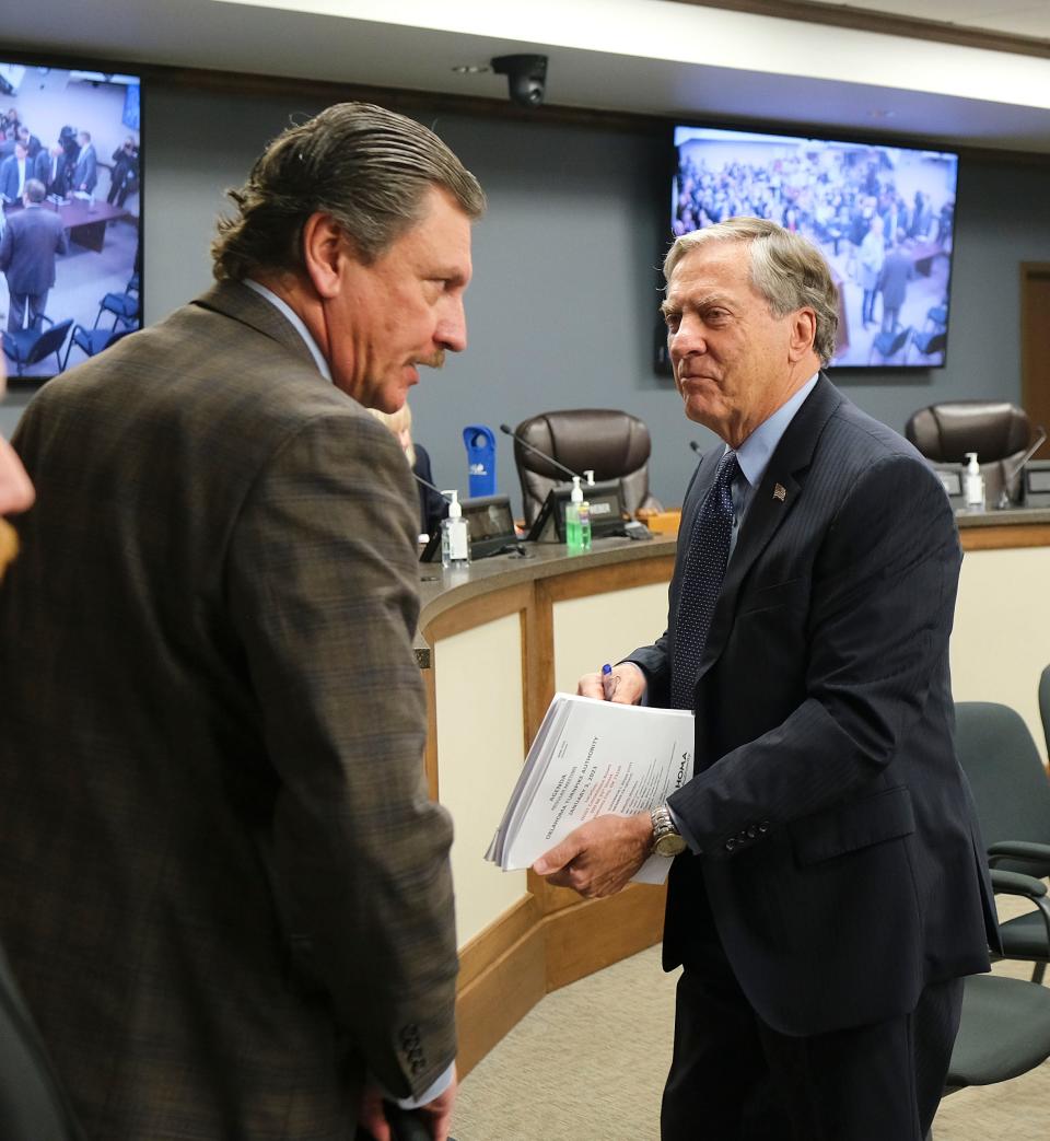 Oklahoma Turnpike Authority Board Chair Gene Love, right, talks Tuesday, Jan. 3, 2023, with Tim Gatz, state transportation secretary, during a meeting of the Oklahoma Turnpike Authority at the Oklahoma Department of Transportation building.