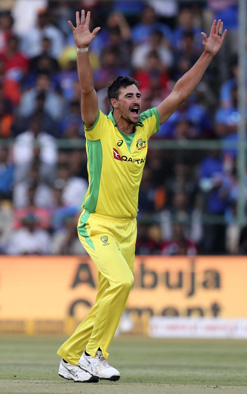 Australia's Mitchell Starc appeals unsuccessfully for the wicket of India's Rohit Sharma during the third one-day international cricket match between India and Australia in Bangalore, India, Sunday, Jan. 19, 2020. (AP Photo/Aijaz Rahi)