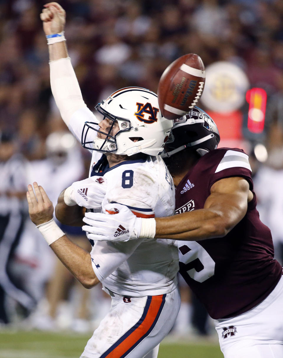 Mississippi State defensive end Montez Sweat (9) forces Auburn quarterback Jarrett Stidham (8) to fumble as he attempts to pass during the second half of their NCAA college football game in Starkville, Miss., Saturday, Oct. 6, 2018. Mississippi State won 23-9. (AP Photo/Rogelio V. Solis)