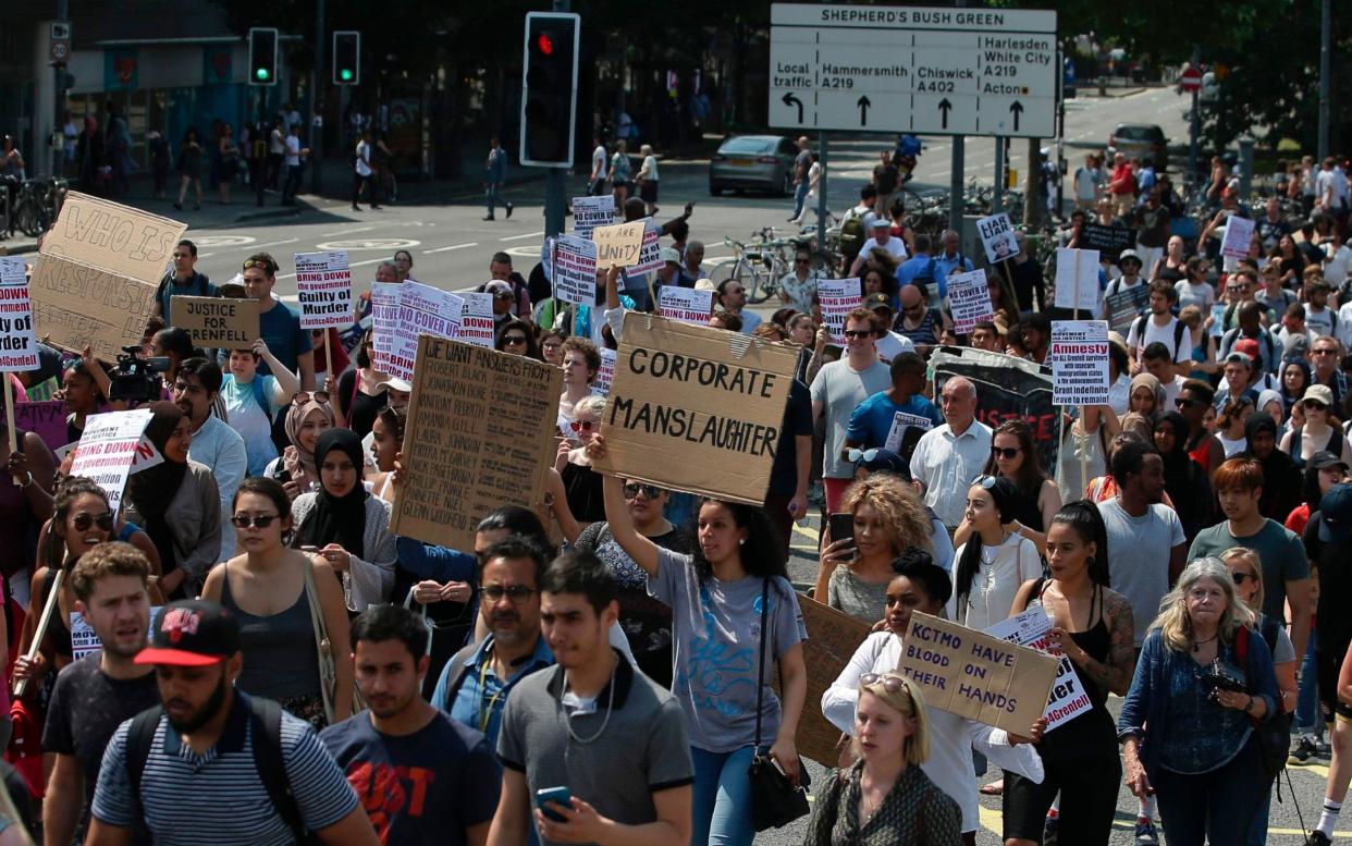 Anti-government protesters leave Shepherd's Bush on their march to Westminster - AFP