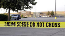 <p>San Antonio police officers investigate the scene where eight people were found dead in a tractor-trailer loaded with at least 30 others outside a Walmart store in stifling summer heat in what police are calling a horrific human trafficking case, Sunday, July 23, 2017, in San Antonio. (AP Photo/Eric Gay) </p>