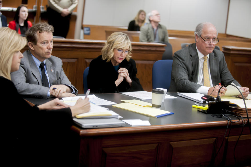 U.S. Sen. Rand Paul, left, his wife Kelley Paul, and attorney Tom Kerrick listen to questions Monday, Jan. 28, 2019, during jury selection in a civil trial against Paul's neighbor, Rene Boucher, in Warren Circuit Court in Bowling Green, Ky. Rand Paul is suing Boucher, who broke Paul's ribs with a hard tackle while he was doing yard work at his Kentucky home in 2017. (Bac Totrong/Daily News via AP)
