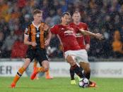 Football Soccer Britain- Hull City v Manchester United - Premier League - The Kingston Communications Stadium - 27/8/16 Manchester United's Zlatan Ibrahimovic in action with Hull City's Sam Clucas Action Images via Reuters / Lee Smith