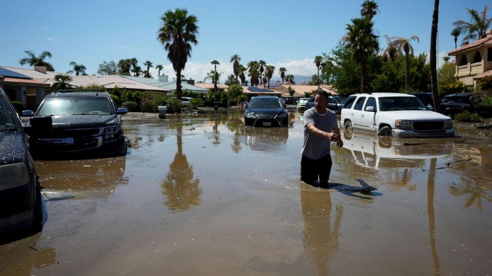 PHOTO: Ronald Mendiola returns his home through a flooded street after Tropical Storm Hilary passed Cathedral City, California, U.S., August 21, 2023. REUTERS/Bryan Woolston? (Bryan Woolston/Reuters)