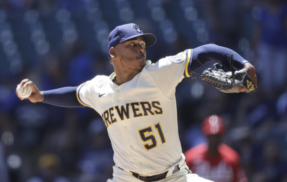 Milwaukee Brewers relief pitcher Freddy Peralta throws to the Cincinnati Reds during the first inning of a baseball game Wednesday, June 16, 2021, in Milwaukee. (AP Photo/Jeffrey Phelps)