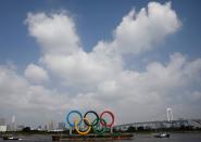 The giant Olympic rings are being temporarily removed for maintenance, amid the coronavirus disease (COVID-19) outbreak, at the waterfront area at Odaiba Marine Park in Tokyo