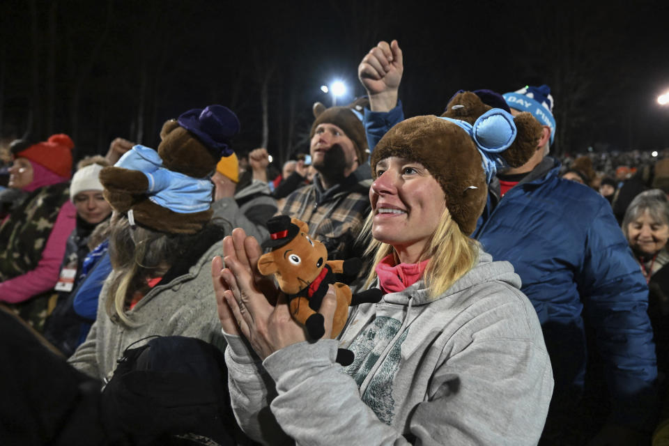 The crowd watches the festivities while waiting for Punxsutawney Phil, the weather prognosticating groundhog, to come out and make his prediction during the 138th celebration of Groundhog Day on Gobbler's Knob in Punxsutawney, Pa., Friday, Feb. 2, 2024. Phil's handlers said that the groundhog has forecast an early spring. (AP Photo/Barry Reeger)