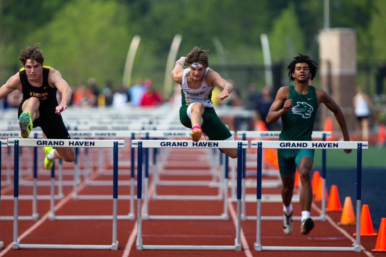 Zeeland West's Keaton Hendricks cross over a hurdle Friday, May 19, 2023, at Grand Haven High School. 