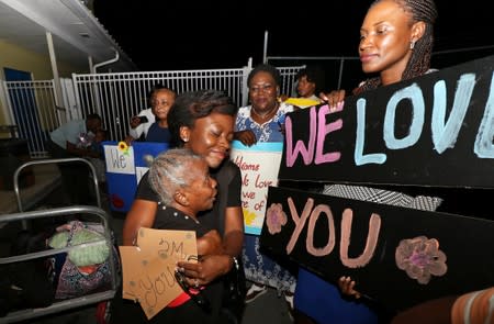 Families react as they are reunited after a church group was evacuated from the Abaco Islands after Hurricane Dorian made landfall in Nassau