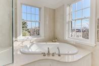 <p>Look out over all of Georgetown from the comfort of a palatial tub. </p>