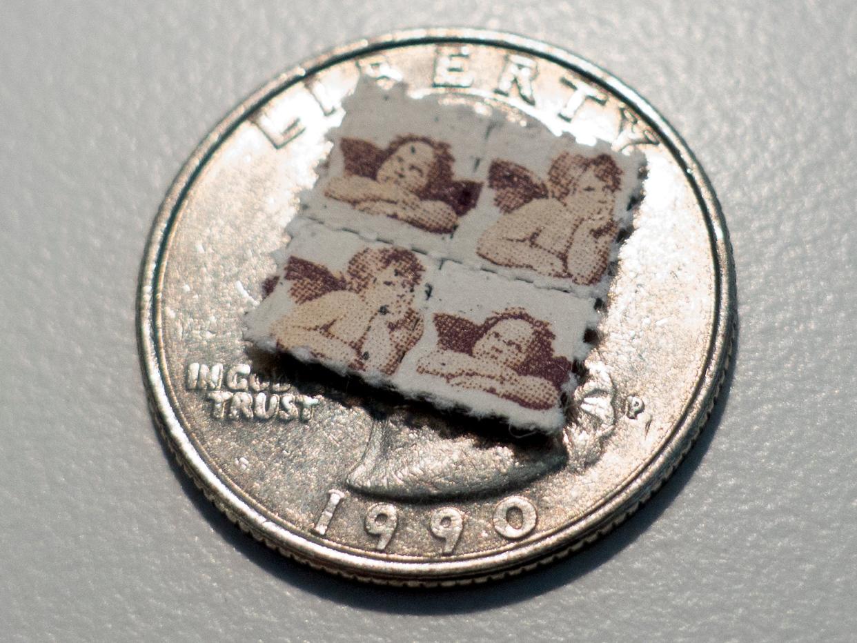 This photo shows LSD blotter tabs on top of a US quarter coin on April 12, 2017, in Washington, DC.   (AFP via Getty Images)