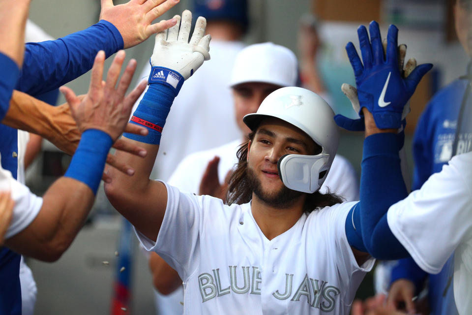 SEATTLE, WASHINGTON - AUGUST 24: Bo Bichette #11 of the Toronto Blue Jays celebrates after hitting a solo home run against the Seattle Mariners in the third inning during their game at T-Mobile Park on August 24, 2019 in Seattle, Washington. Teams are wearing special color schemed uniforms with players choosing nicknames to display for Players' Weekend.  (Photo by Abbie Parr/Getty Images)