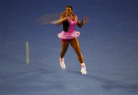 Serena Williams of the United States hits a return to Ashleigh Barty of Australia during their women's singles match at the Australian Open 2014 tennis tournament in Melbourne January 13, 2014. REUTERS/Petar Kujundzic