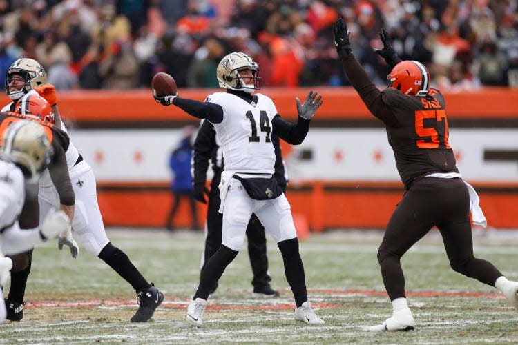 Cleveland Browns defensive tackle Ben Stille (57) pressures New Orleans Saints quarterback Andy Dalton during a game on Dec. 24, 2022, at Cleveland.