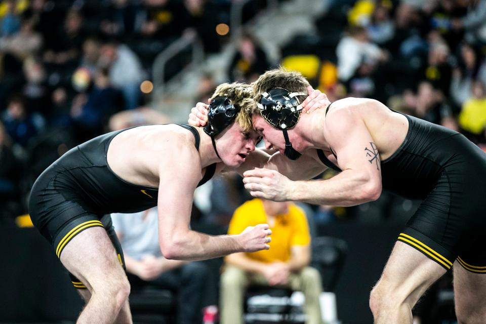 Iowa's Caleb Rathjen, left, wrestles Iowa's Max Murin at 149 pounds in the finals during the Soldier Salute college wrestling tournament last month.