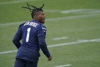 Seattle Seahawks wide receiver D'Wayne Eskridge tracks a pass as he runs a drill during NFL football practice Tuesday, June 15, 2021, in Renton, Wash. (AP Photo/Ted S. Warren)