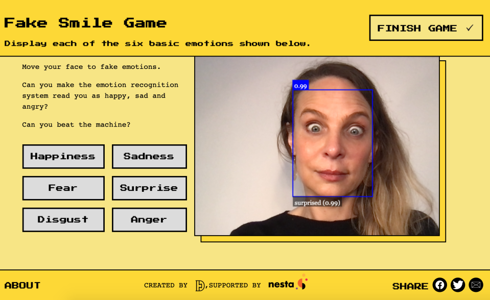 Dr Alexa Hagerty plays a game on the Emojify website, which demonstrates AI emotion recognition technology. (Cambridge University/ PA)