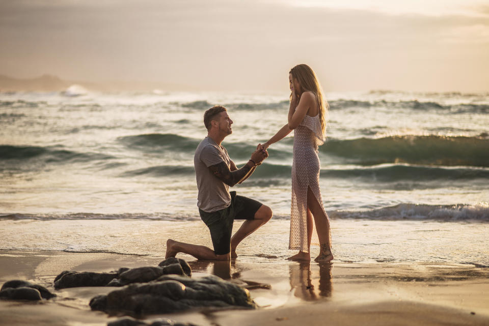 Man proposing on beach