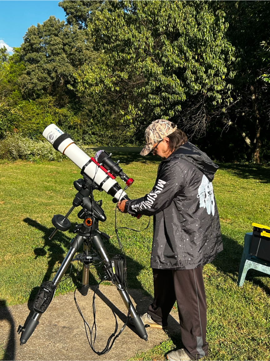 Ricky Smith of Powell gets his equipment just right to be able to photograph the heavens.