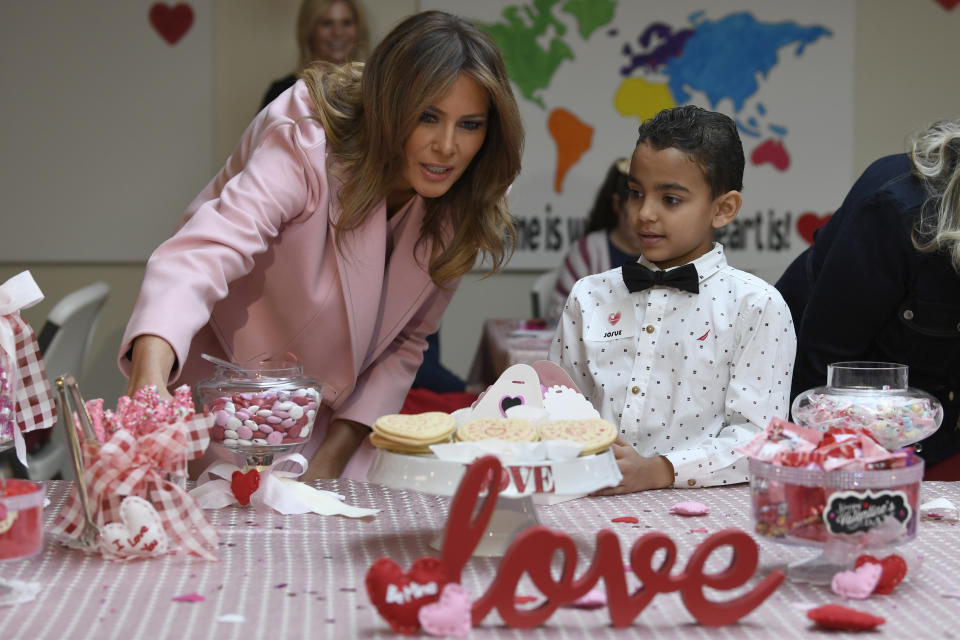 First lady Melania Trump talks with Josue during her visit to the National Institutes of Health to see children at the Children's Inn in Bethesda, Md., Thursday, Feb. 14, 2019, and celebrate Valentine's Day. (AP Photo/Susan Walsh)