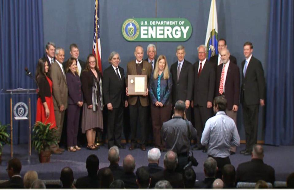 The Salt Waste Disposal Technologies Team led by Oak Ridge National Laboratory's Bruce Moyer received the Secretary of Energy Achievement Award from then-U.S. Department of Energy Secretary Ernie Moniz (center, to the left of Moyer, who is holding the award).