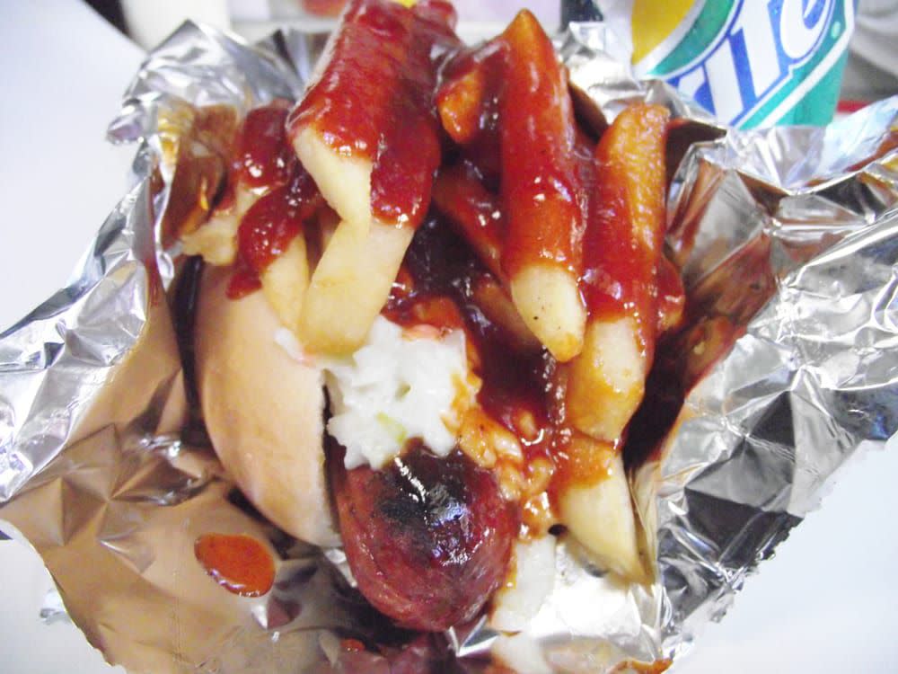 Polish boy hot dog topped with french fries