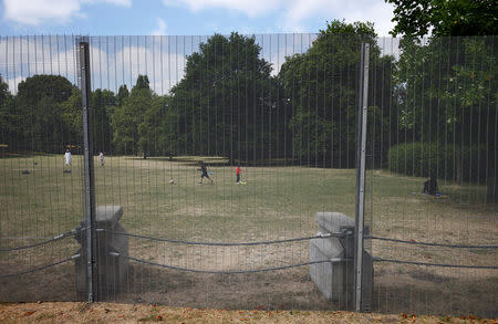 A security fence is seen near the U.S. ambassador's residence, ahead of the U.S. presidential visit, in Regents Park, London, Britain July 11, 2018. REUTERS/Henry Nicholls