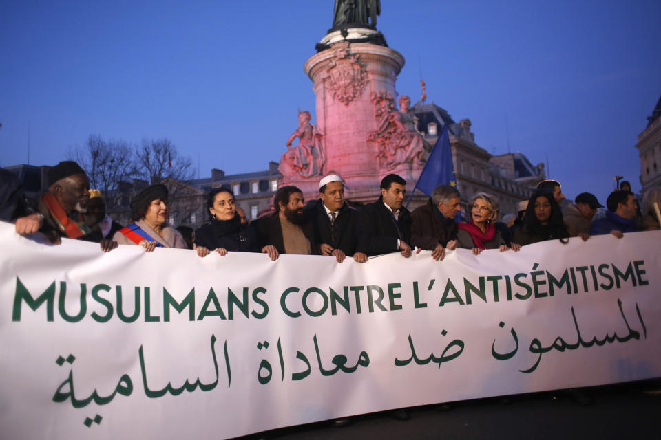 French Muslim gather at the Republique square to protest against anti-Semitism in Paris, France, Feb. 19, 2019. In Paris and dozens of other French cities, ordinary citizens and officials across the political spectrum geared up Tuesday to march and rally against anti-Semitism, following a series of anti-Semitic acts that shocked the nation. (AP Photo/Thibault Camus)