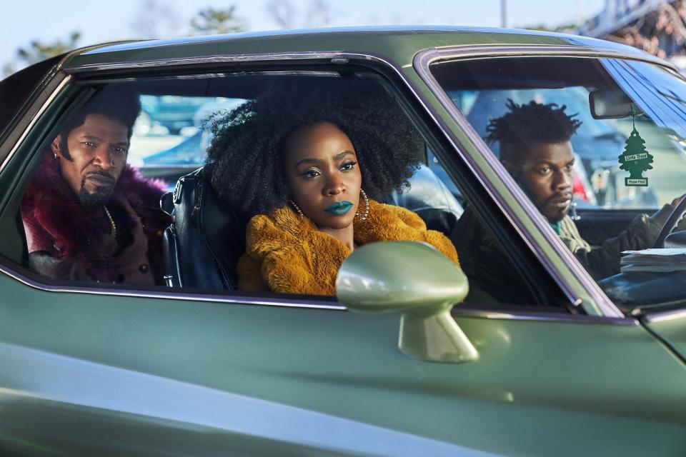 A group of people sit in a car