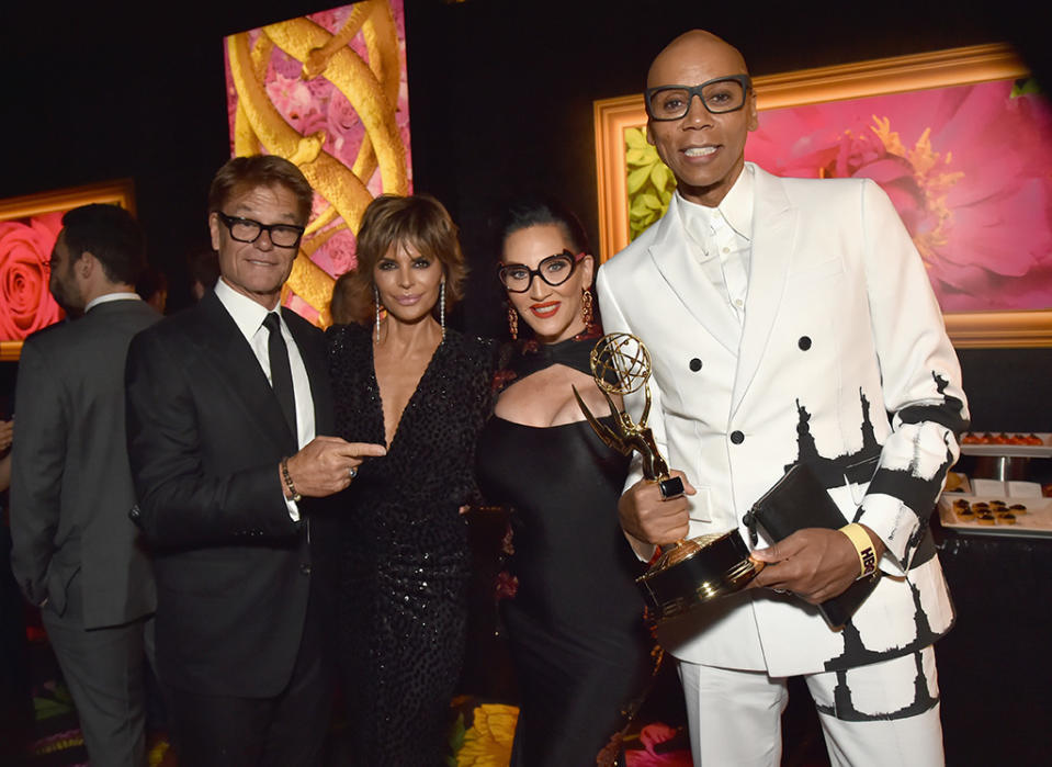 <p>Outstanding Host for a Reality or Reality-Competition Program RuPaul toasted his win with <em>RuPaul’s Drag Race</em> partner-in-crime Michelle Visage and married actors Harry Hamlin and Lisa Rinna at HBO’s party. (Photo: Jeff Kravitz/FilmMagic for HBO) </p>