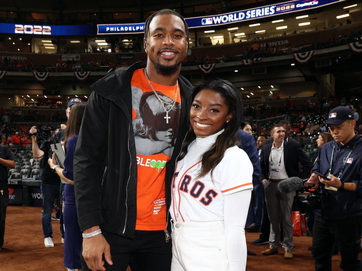 Olympic gold medalist Simone Biles and Houston Texans safety Jonathan Owens are seen prior to Game 1 of the 2022 World Series between the Philadelphia Phillies and the Houston Astros at Minute Maid Park on Friday, October 28, 2022