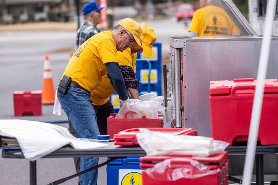 Volunteers with a N.C. Baptists on Mission disaster relief crew prepare meals for people effected by power outages in Moore County Tuesday, Dec. 6, 2022 at the First Baptist Church of Pinehurst . Two deliberate attacks on electrical substations in Moore County Saturday evening caused days-long power outages for tens of thousands of customers.