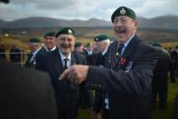 FORT WILLIAM, UNITED KINGDOM - NOVEMBER 11: Former commando Ken Dorans from Peterhead joins servicemen veterans as they attend a remembrance Sunday ceremony at Commando Memorial on November 11, 2012 in Spean Bridge, Scotland. Remembrance Sunday tributes were carried out across the nation to pay respects to all who those who lost their lives in current and past conflicts, including the First and Second World Wars (Photo by Jeff J Mitchell/Getty Images)