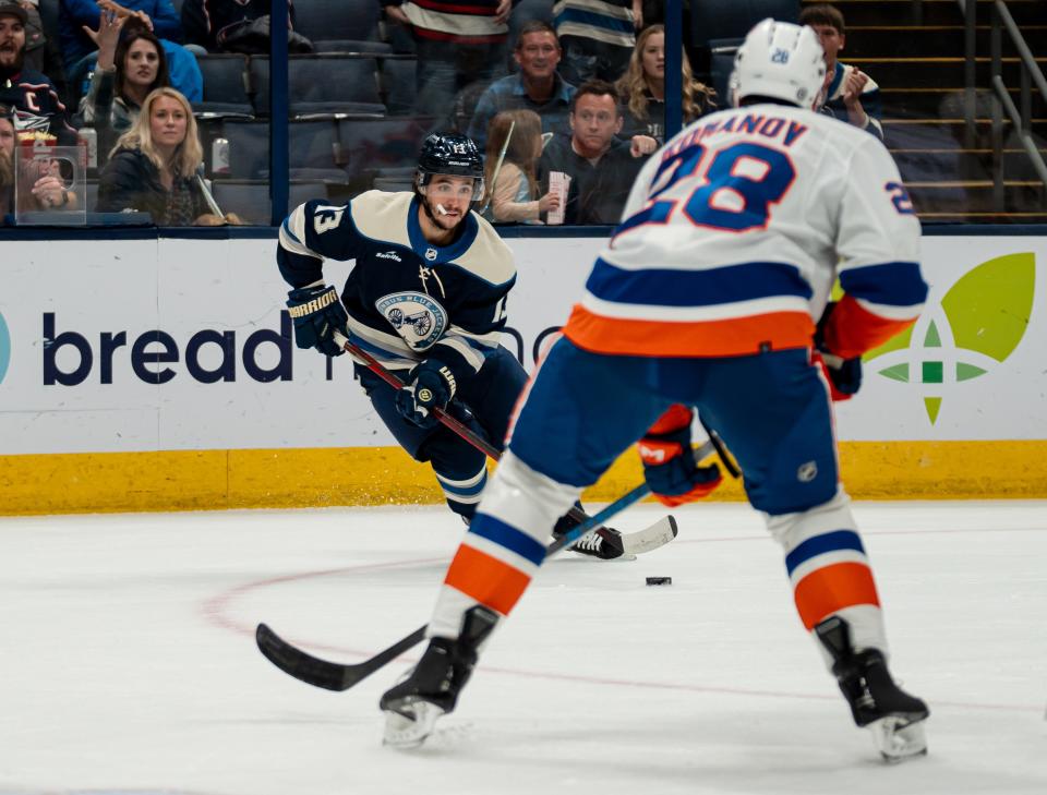Oct 28, 2023; Columbus, Ohio, United States;
Columbus Blue Jackets left wing Johnny Gaudreau (13) looks for an open pass during their game against New York Islanders defenseman Alexander Romanov (28) on Saturday, Oct. 28, 2023 at Nationwide Arena.