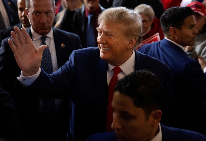 FILE PHOTO: FILE PHOTO: Former U.S. President and Republican presidential candidate Donald Trump attends a "commit to caucus" event, in Ankeny