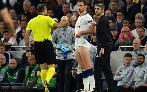 After changing his shirt and shorts, the referee checked the defender was okay to come back on - Credit: Reuters