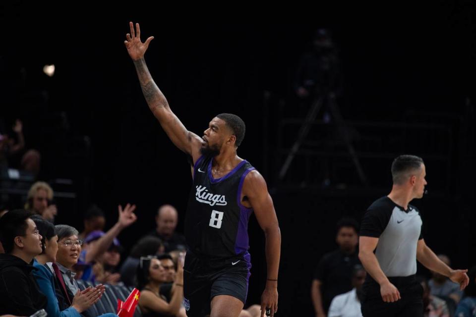 Sacramento Kings guard Mason Jones (8) signals three to the crowd after making a 3-point shot in the second half of the California Classic summer league game between the Kings and the Chinese national team at Golden 1 Center on Saturday, July 6, 2024.