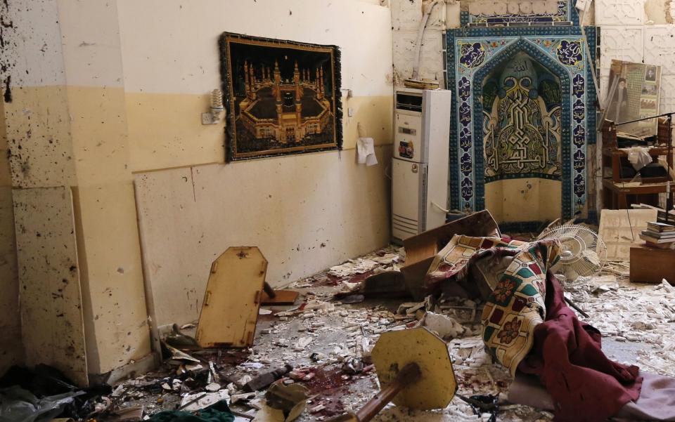 A view shows the damage at the site of a bomb attack inside a Shi'ite mosque in Baghdad May 27, 2014. (REUTERS/Thaier Al-Sudani)