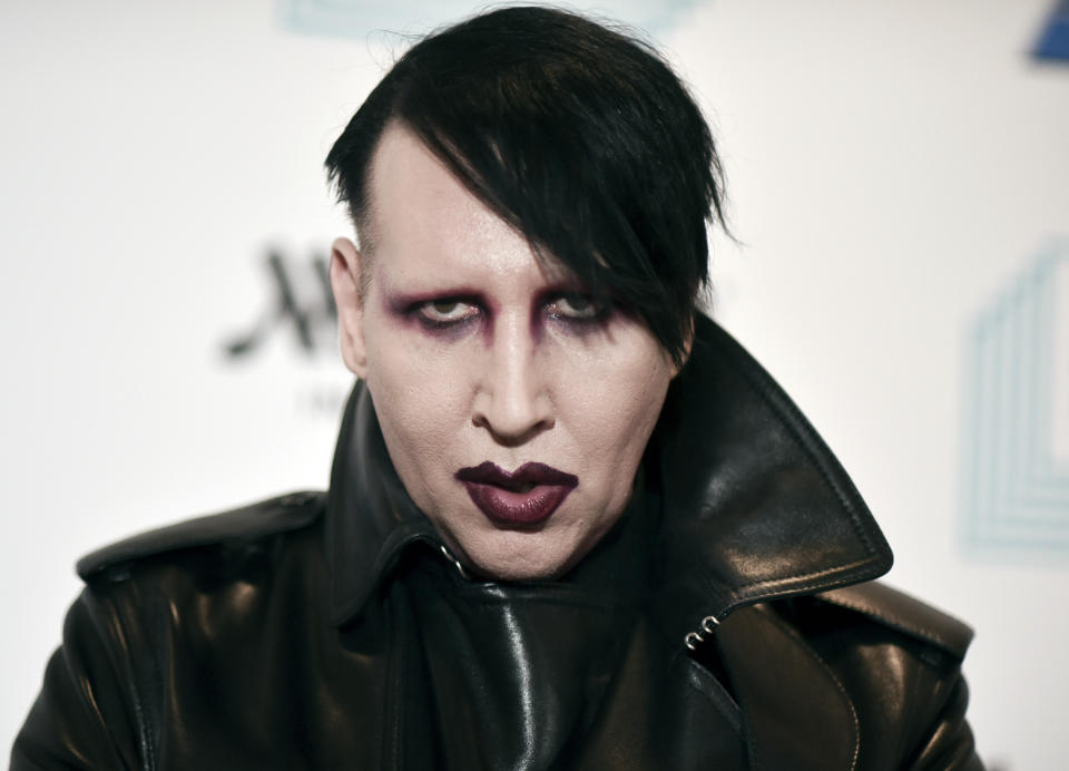 FILE - In this Dec. 10, 2019, file photo, Marilyn Manson attends the 9th annual "Home for the Holidays" benefit concert in Los Angeles. On Friday, July 2, 2021, Manson, born Brian Hugh Warner, turned himself in to law enforcement in Los Angeles, in relation to a 2019 arrest warrant for acts alleged to have occurred while performing a concert in Gilford, NH. Warner was processed and released on personal recognizance bail. (Photo by Richard Shotwell/Invision/AP, File)
