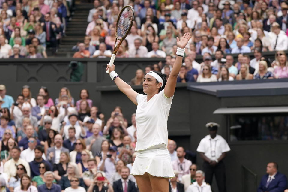 Tunisia's Ons Jabeur celebrates beating Aryna Sabalenka of Belarus to win their women's singles semifinal match on day eleven of the Wimbledon tennis championships in London, Thursday, July 13, 2023. (AP Photo/Alberto Pezzali)