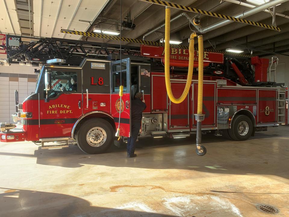 A firefighter enters the Ladder 8 truck before being dispatched from Station 8.