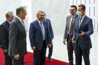 In this photo released by Russian Foreign Ministry Press Service, Russian Foreign Minister Sergey Lavrov, second left, and Syrian President Bashar al-Assad, talk to each other prior to their talks in Damascus, Syria, Monday, Sept. 7, 2020. Russia's foreign minister has met with Syrian President Bashar Assad shortly after landing in the Syrian capital on his first visit since 2012. Russia has been a close ally of Assad in Syria's long and bloody nine-year-long civil war, lending his government in Damascus vital military, economic and political support. (Russian Foreign Ministry Press Service via AP)