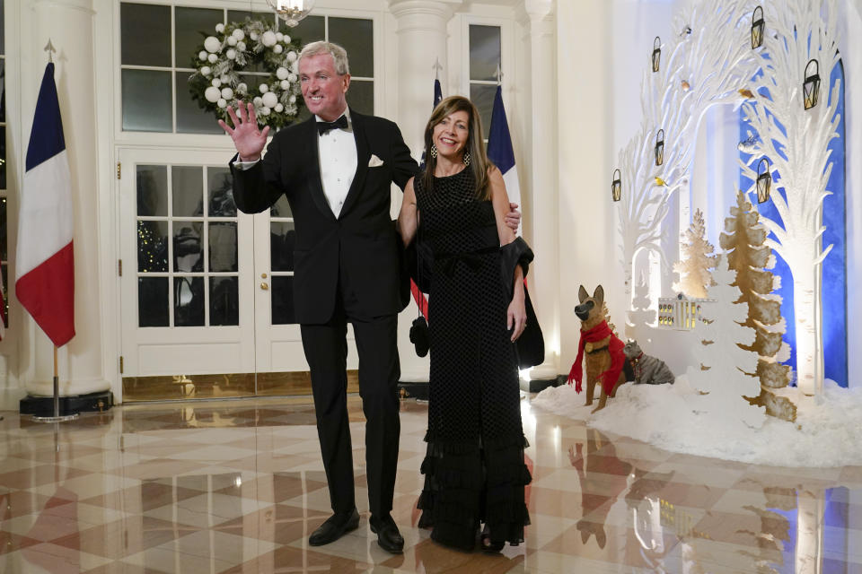 New Jersey Gov. Phil Murphy and his wife Tammy Murphy arrive for the State Dinner with President Joe Biden and French President Emmanuel Macron at the White House in Washington, Thursday, Dec. 1, 2022. (AP Photo/Susan Walsh)